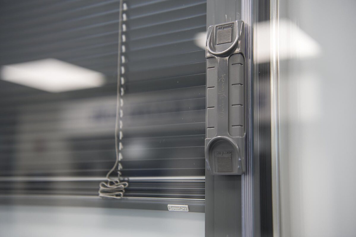 Magnetic slider for an integral window blind