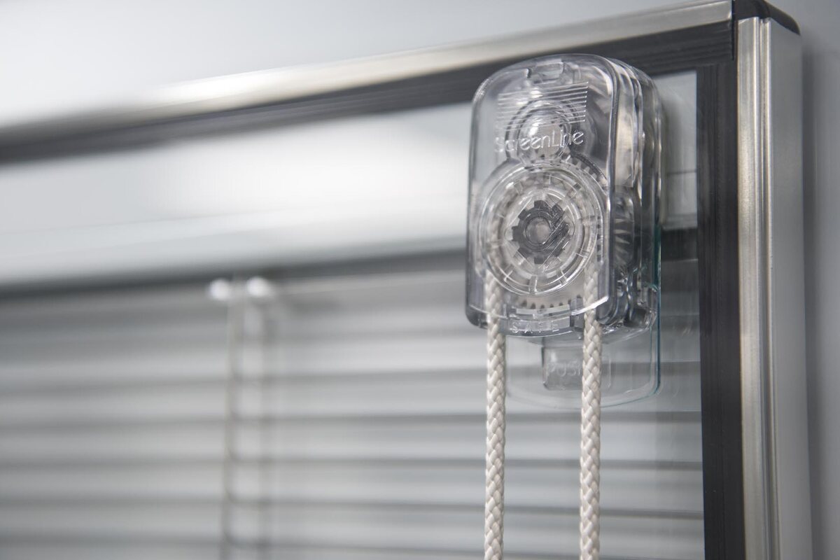 Manual control fitted to integral blind glazing