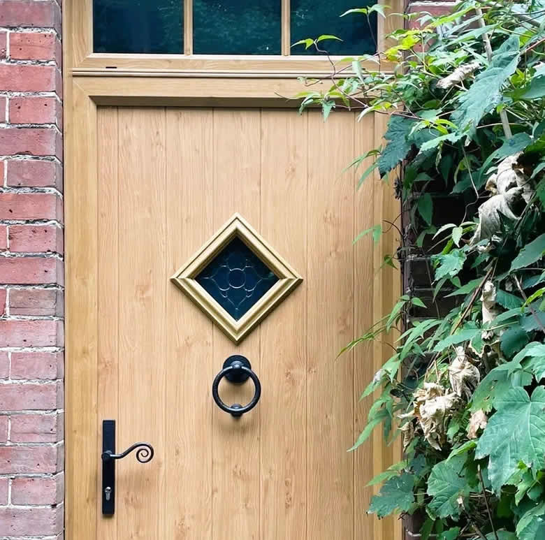 Cornwall composite front door in Irish Oak with top light and Astragal bars in Bressingham