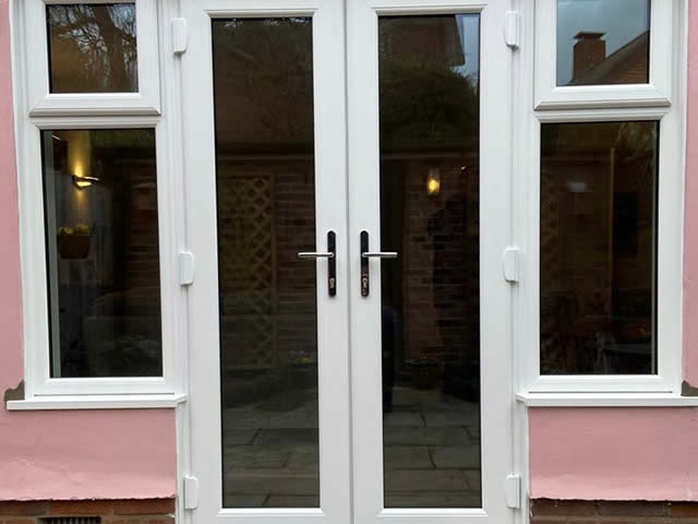 White uPVC French doors and adjoining windows - Bury St Edmunds