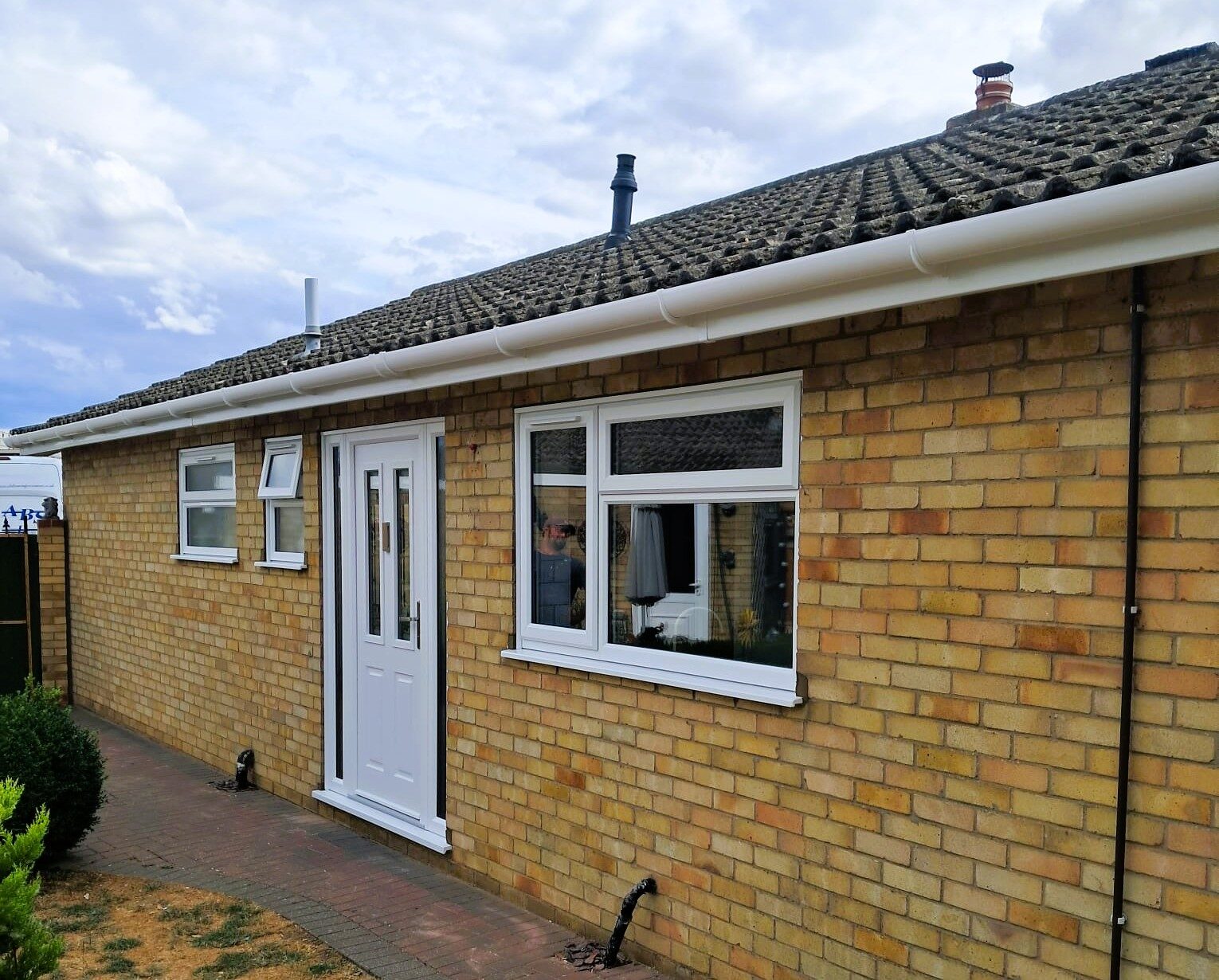 New white uPVC windows, composite entrance door and roofline installed at a home in Diss