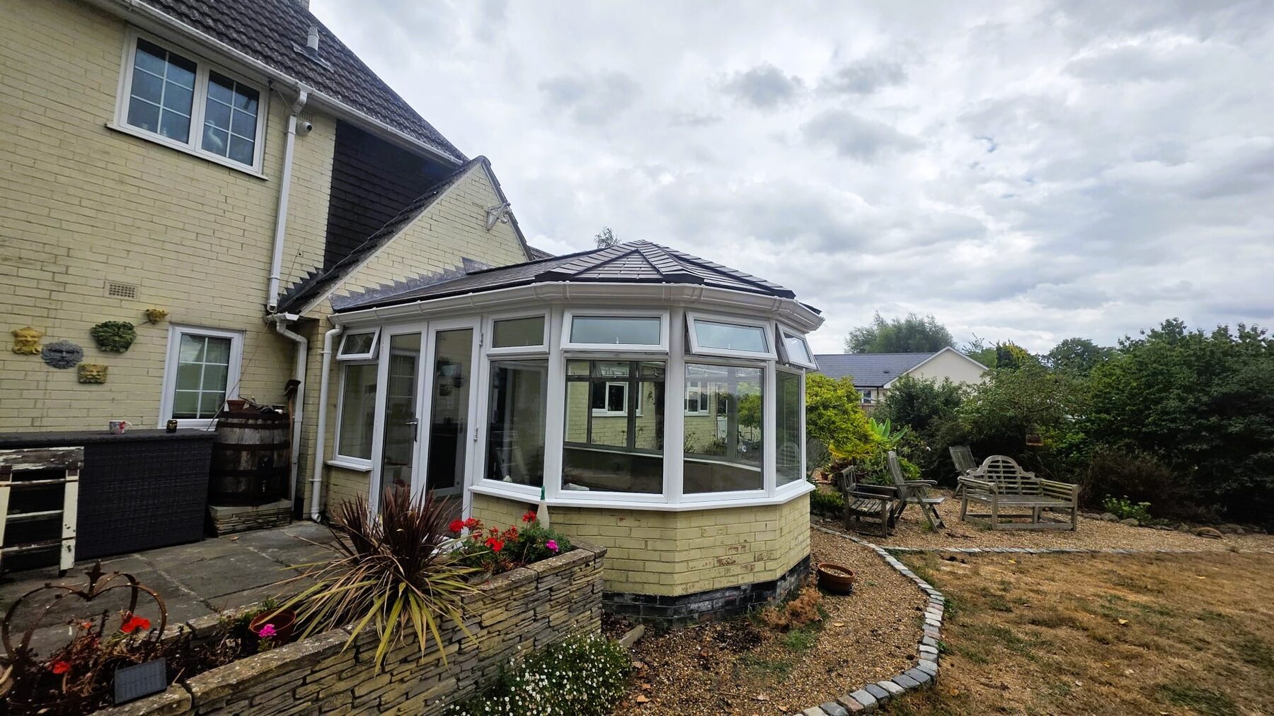 Completed lean-to style solid roof fitted to existing conservatory frames in Eye