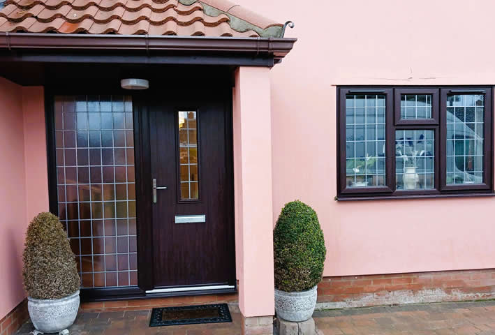 Rosewood-on-white uPVC windows and composite door installation in Haughley Green