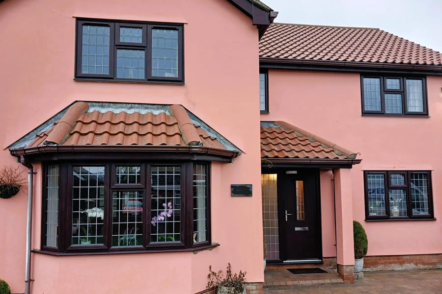 Rosewood-on-white windows fitted throughout property in Haughley Green